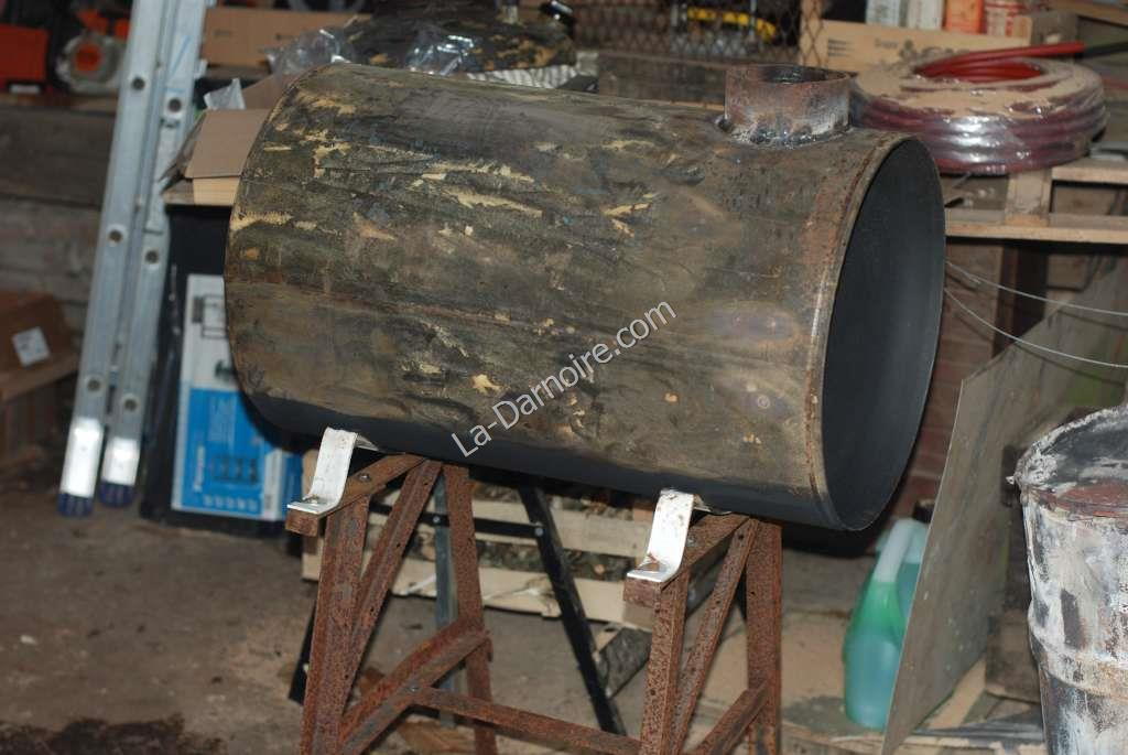 Woodstove being painted with high-temperature paint