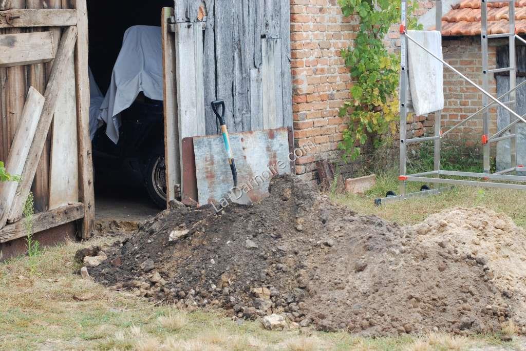 The trench is excavated between the house and the borehole